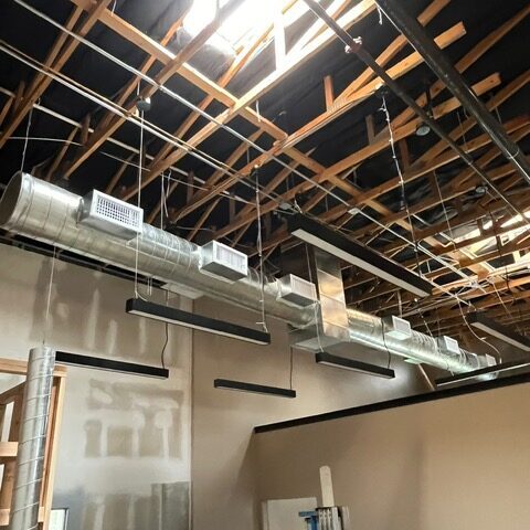 Commercial HVAC Phoenix Exposed ductwork in a construction space.